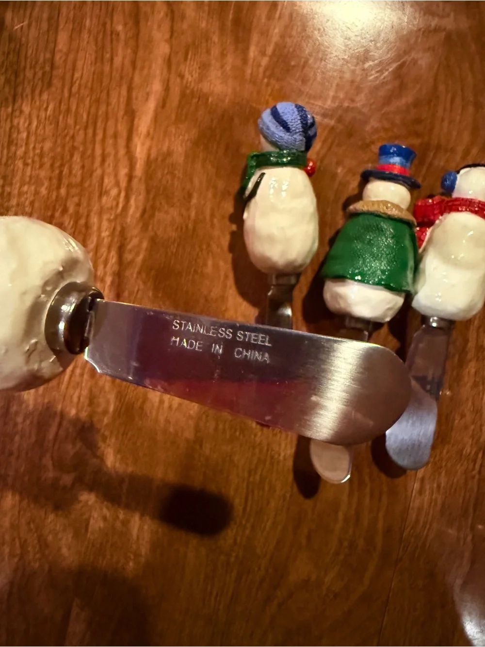 Bundle of stainless steel snowman 2 inch cheese spreaders